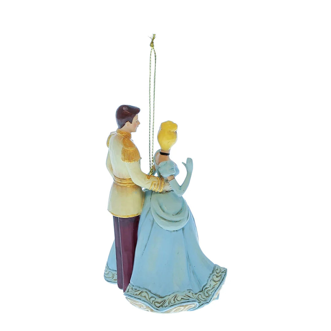 Decorative figurine of The prince and Cinderella holding hands on a white background