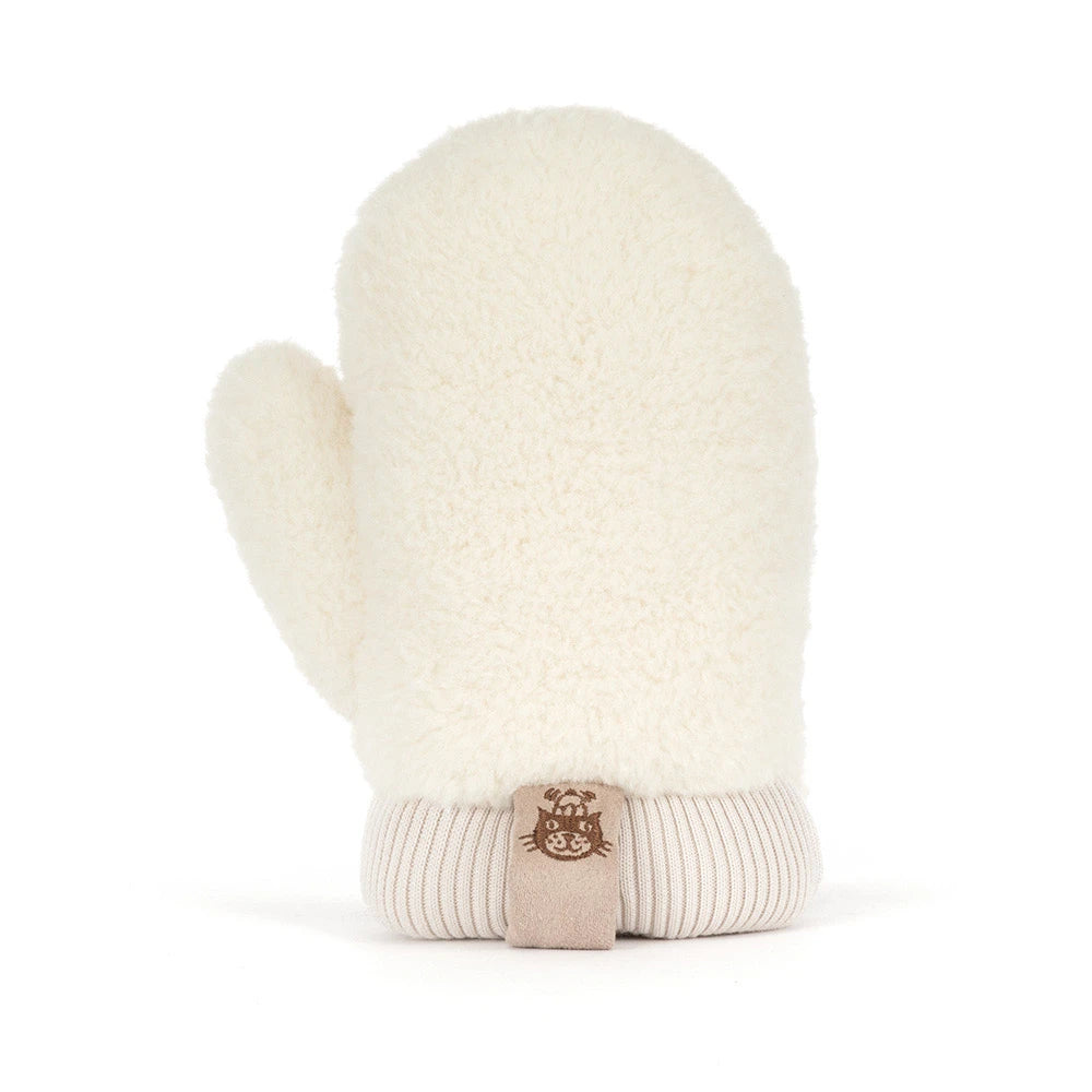 Jellycat amuseables mitten plush toy in a warm taupe-brown fabric with cream sherpa trim, featuring a simple embroidered smiley face and small feet, shown on a clean white background.