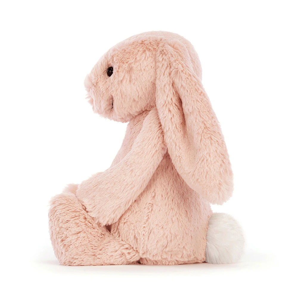 Fluffy pink bashful Jellycat plush bunny toy on a white background
