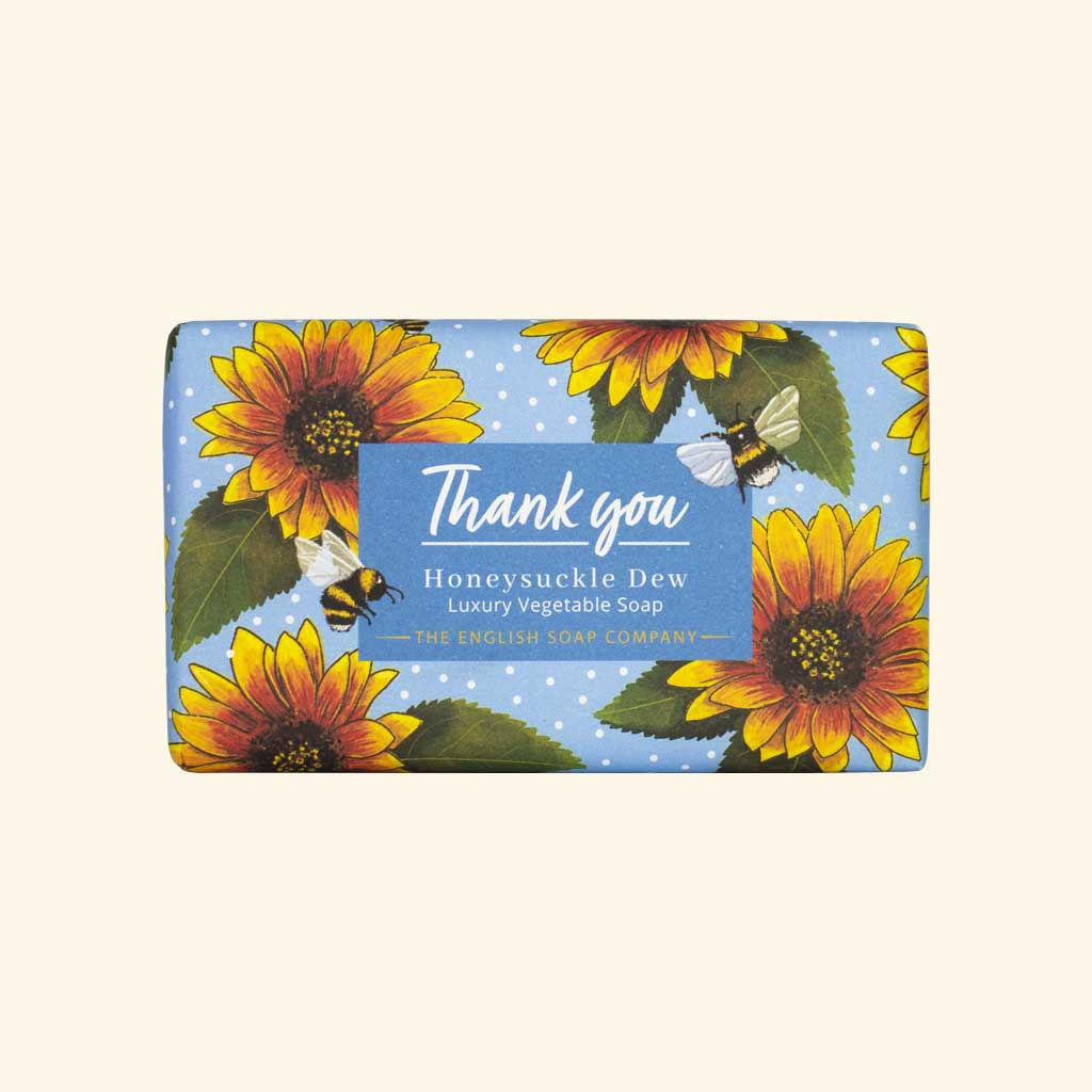Soap bar with sunflowers and bees design on a blue background