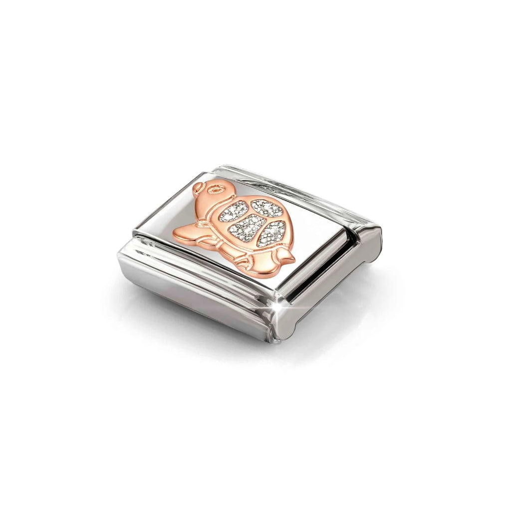 Nomination composable charm link featuring a rose gold turtle design with silver glitter enamel on its shell, set against a plain white background.
