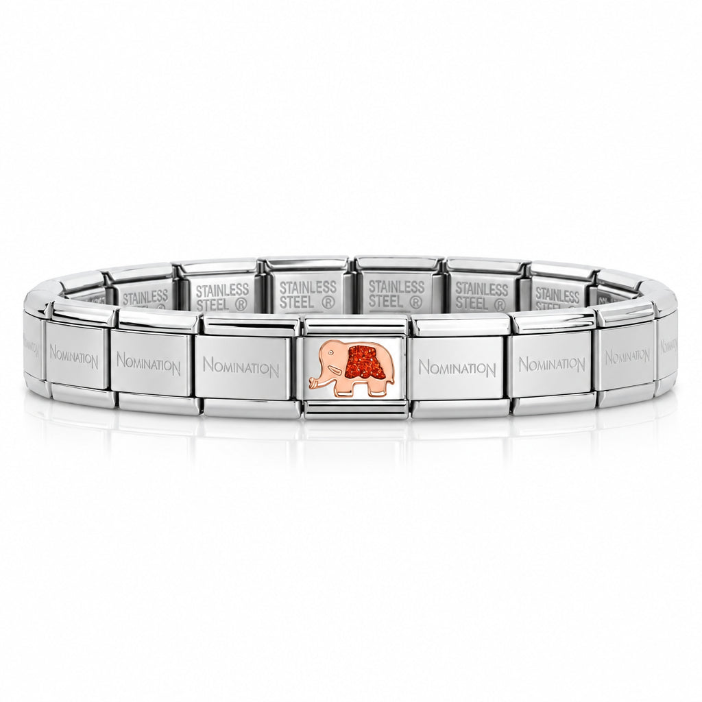 A silver stainless steel nomination italy bracelet. Featuring a rose gold & glitter red elephant charm. Shown on a white background with the text 'BRACELET SOLD SEPARATELY' below.