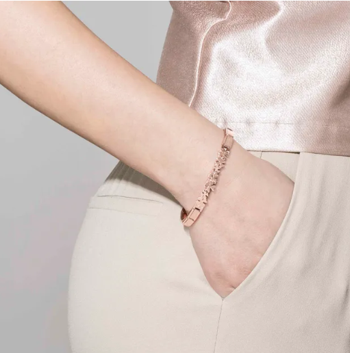 Nomination Italy Rose gold coloured trendsetter bracelet on a wrist with a neutral background