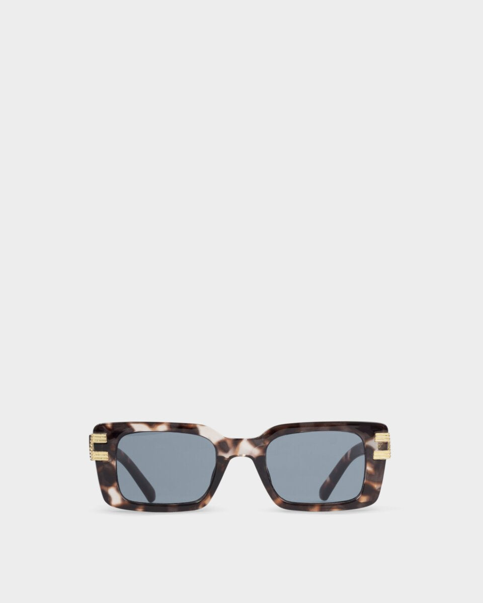 katie loxton malibu tortoiseshell Sunglasses with tortoiseshell frame and blue lenses on a white background