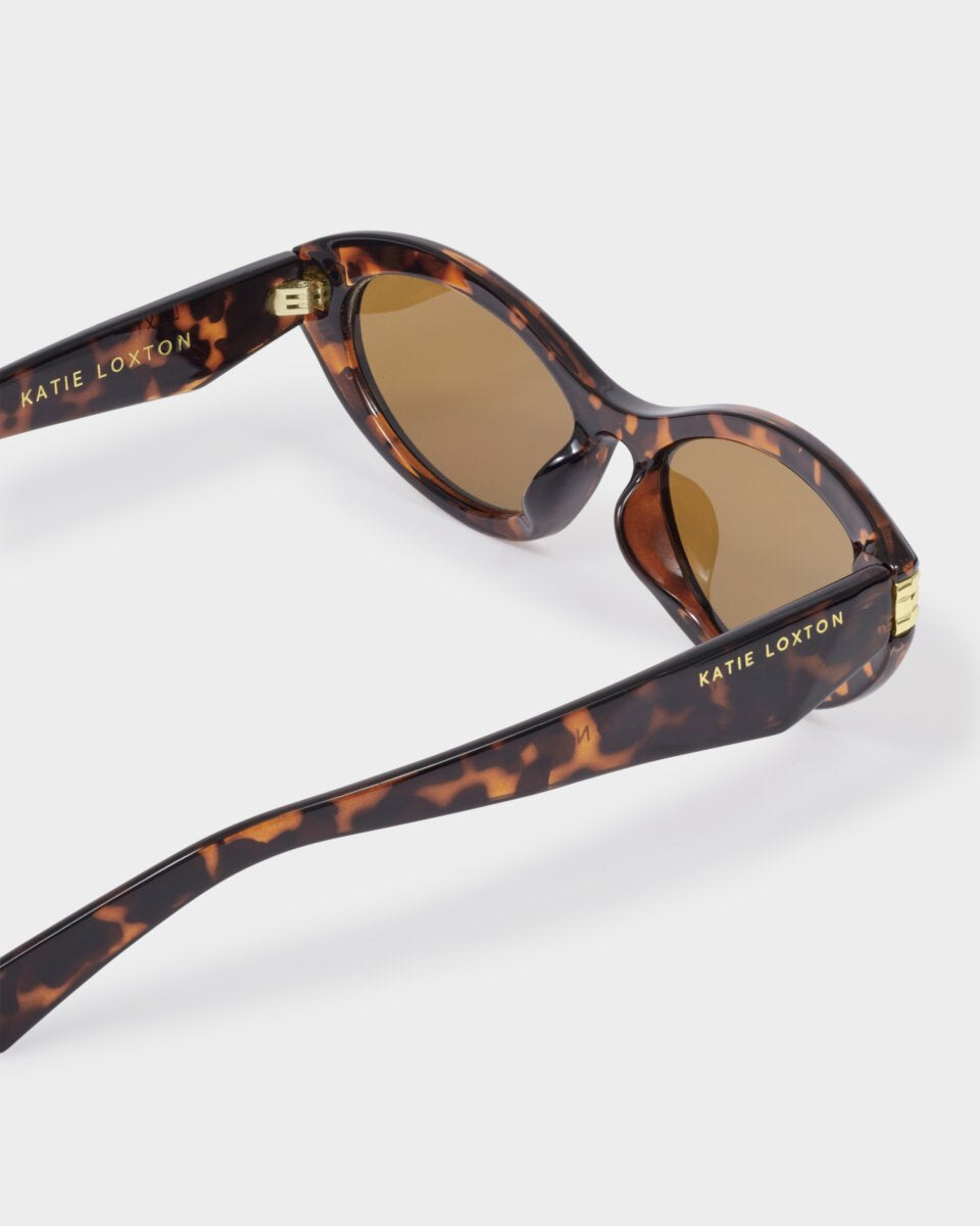 katie lxton Sunglasses with tortoiseshell frame and brown lenses on a white background