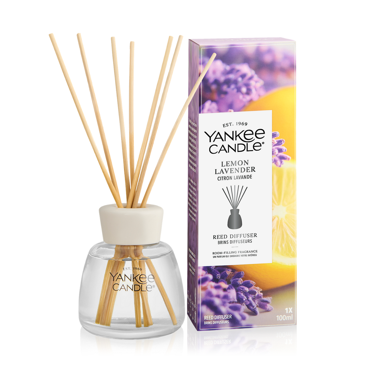 Yankee Candle Lemon Lavender reed diffuser bottle with natural reed sticks next to its retail box, on a clean white background.