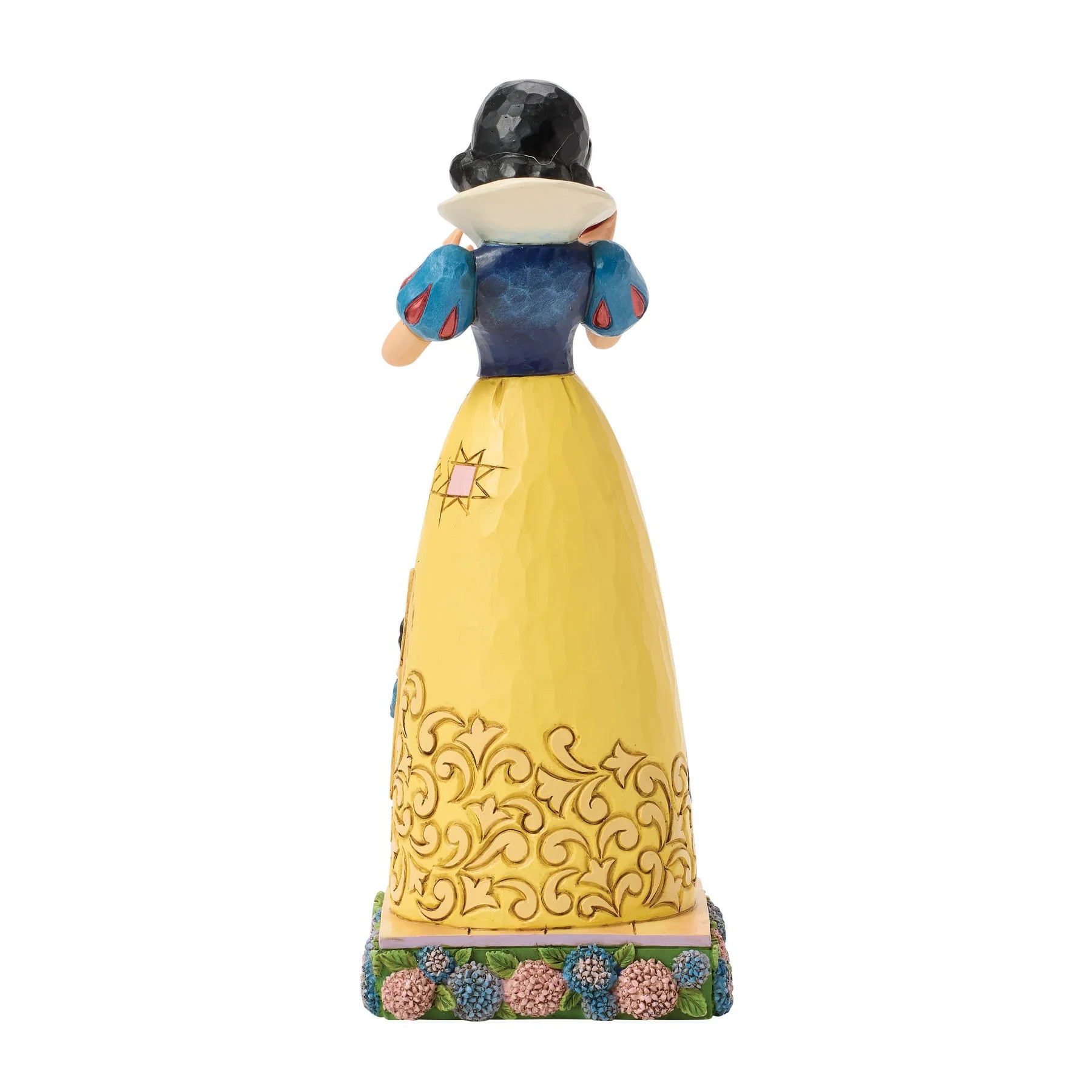 Snow White figurine with yellow dress and blue top on a white background