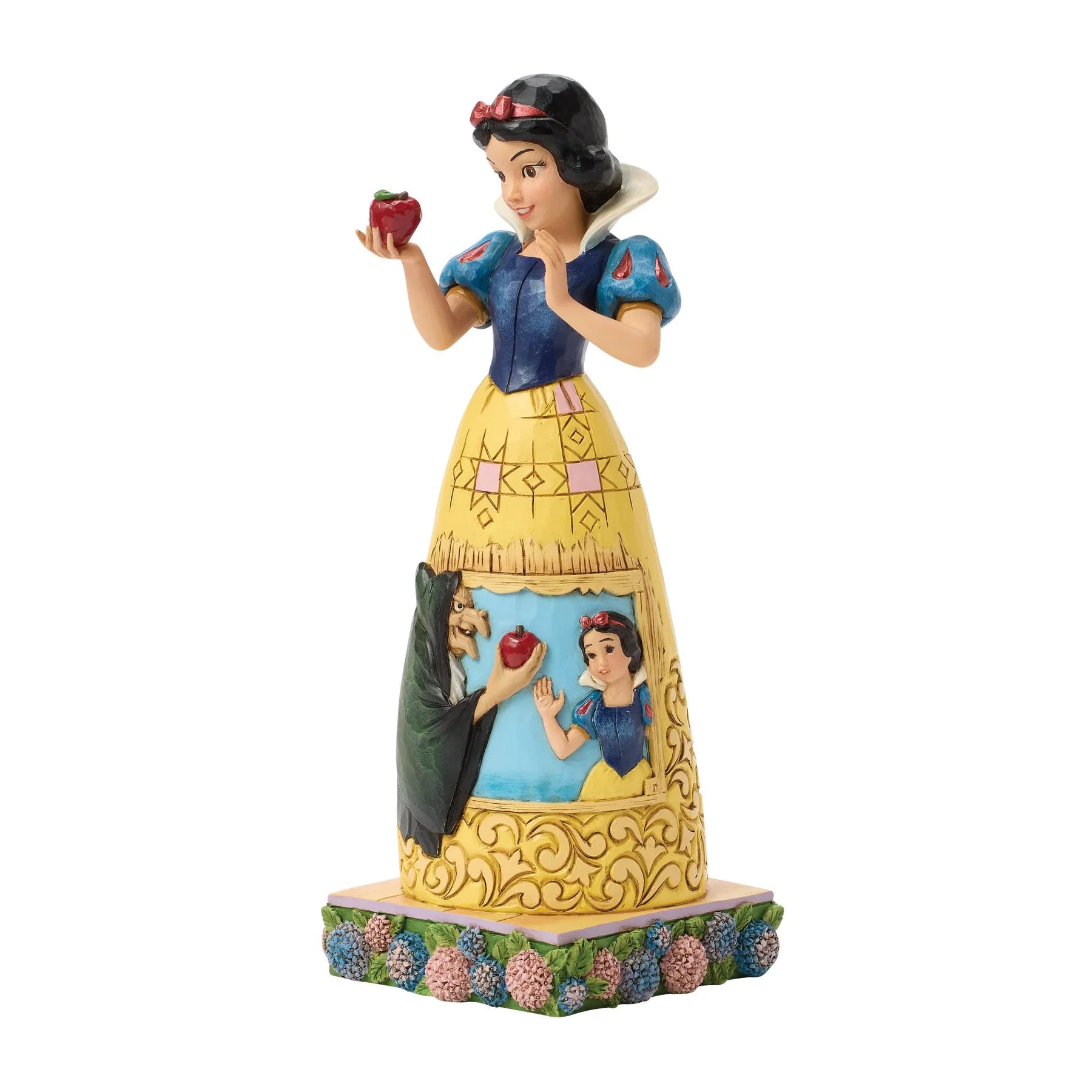 Snow White figurine holding an apple on a white background
