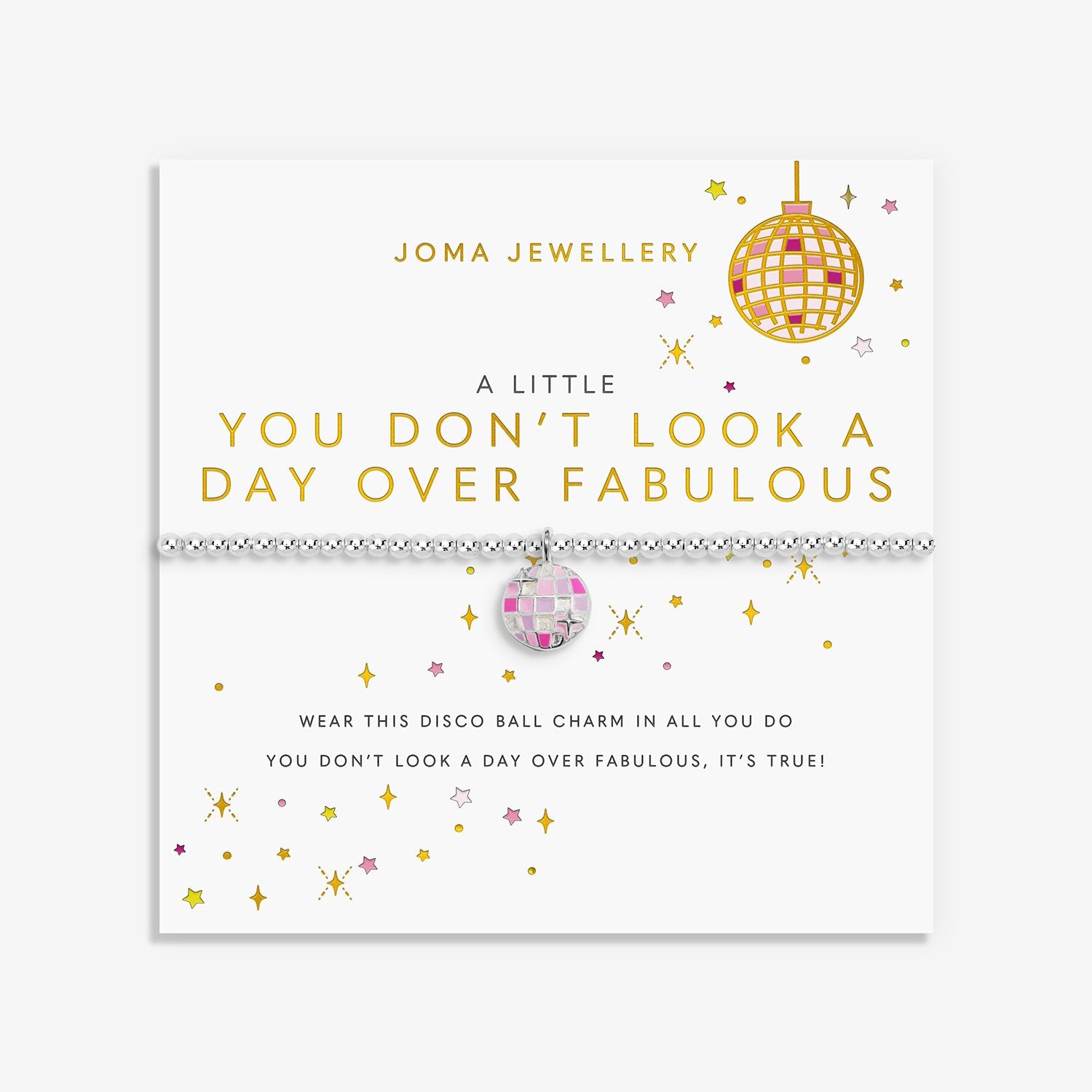 A Joma Jewellery bracelet displayed on its branded white card packaging. The bracelet features a silver-toned chain with a central disco ball charm containing pink, and white reflective facets.