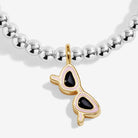 Joma Jewellery Silver beaded bracelet with a gold and black sunglasses pendant on a white background