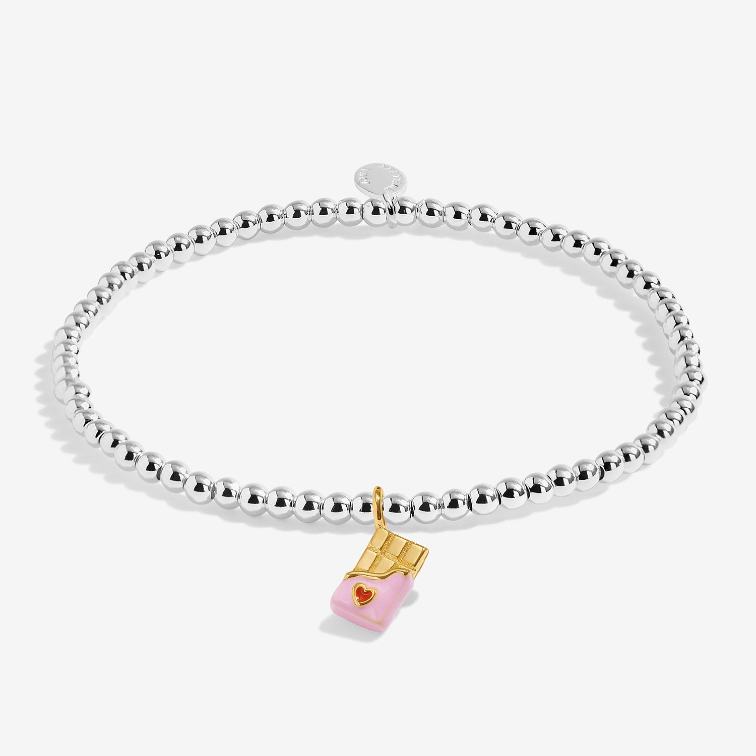 A Joma Jewellery 'A Little Sweet Like Chocolate' bracelet  which features a silver-toned beaded chain with a pink and red heart on a chocolate bar charm.