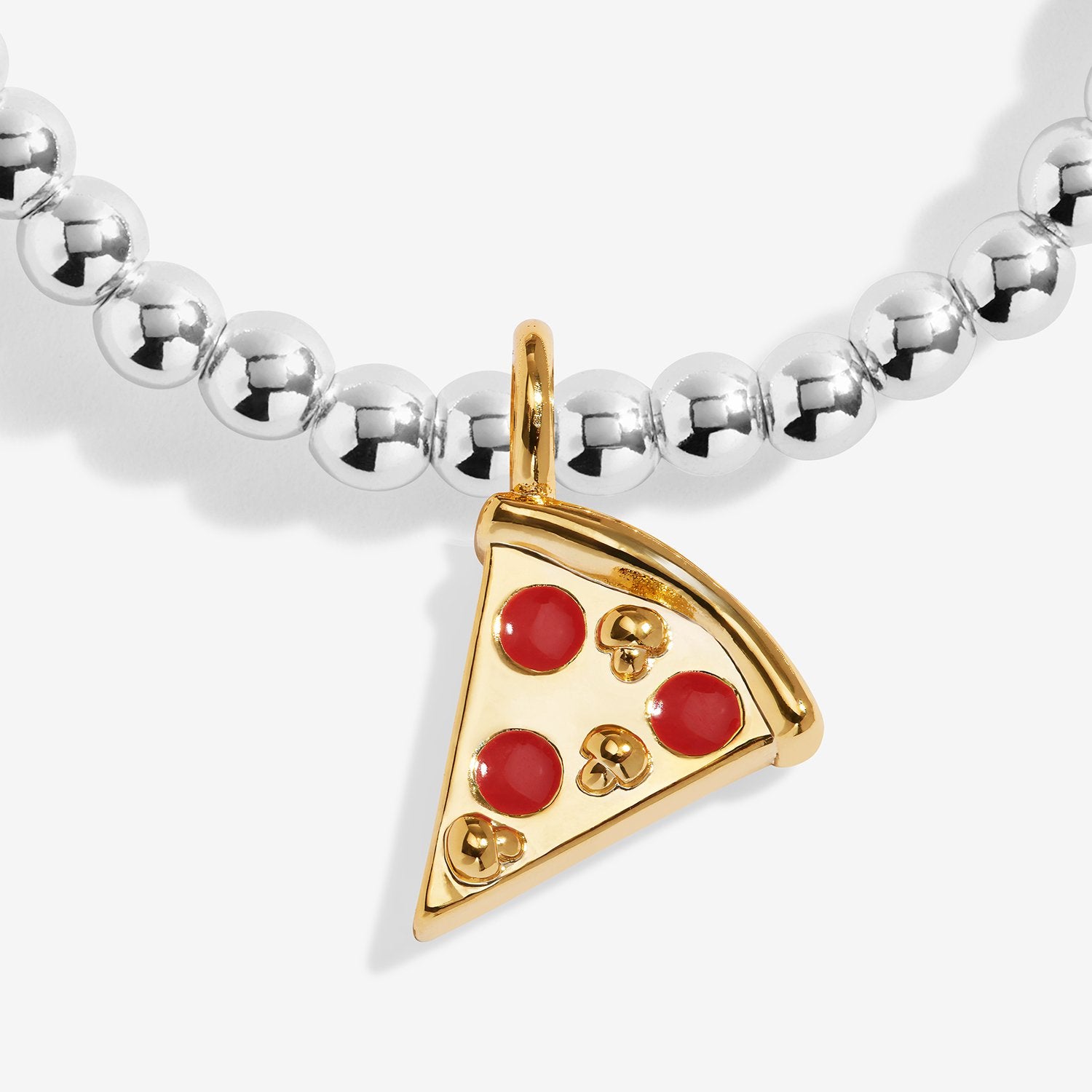 Close up image of Joma Jewellery featuring a small pizza slice on a silver beaded bracelet 