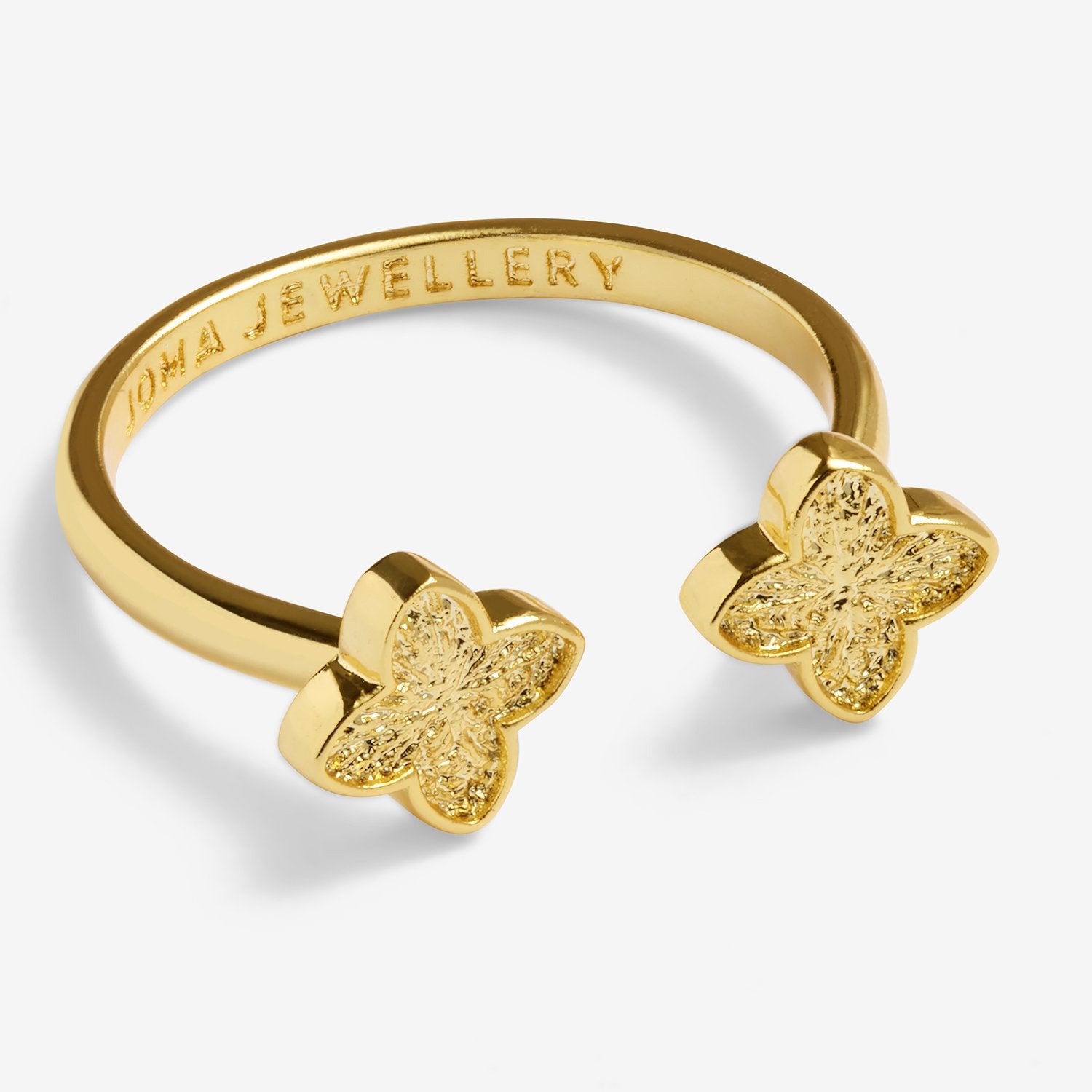 Gold clover ring with 'Thomas Sabo' branding on a white background