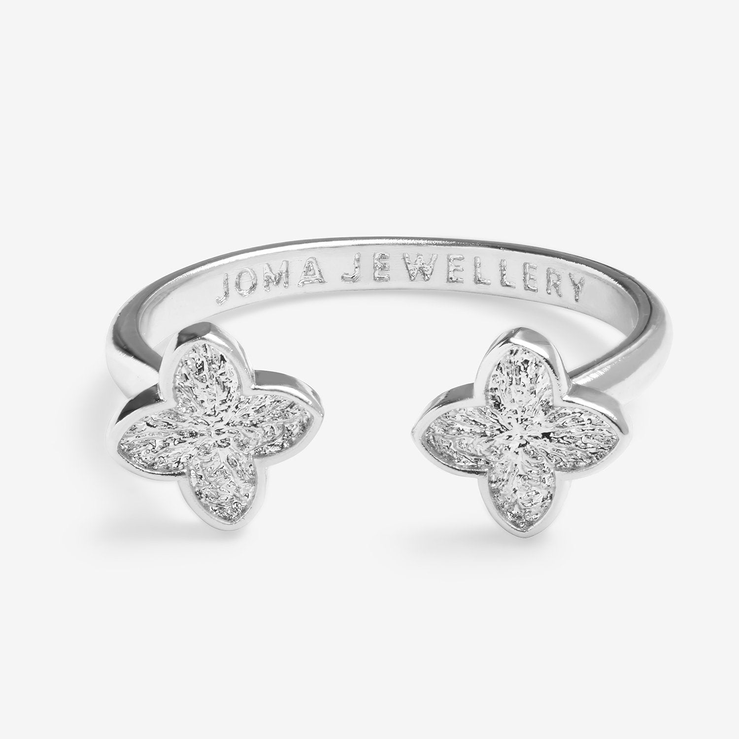 Silver clover ring with 'Joma Jewellery' branding on a white background