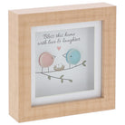 Wooden framed glass pebble picture with birds and text 'Bless this home with love & laughter' on a white background