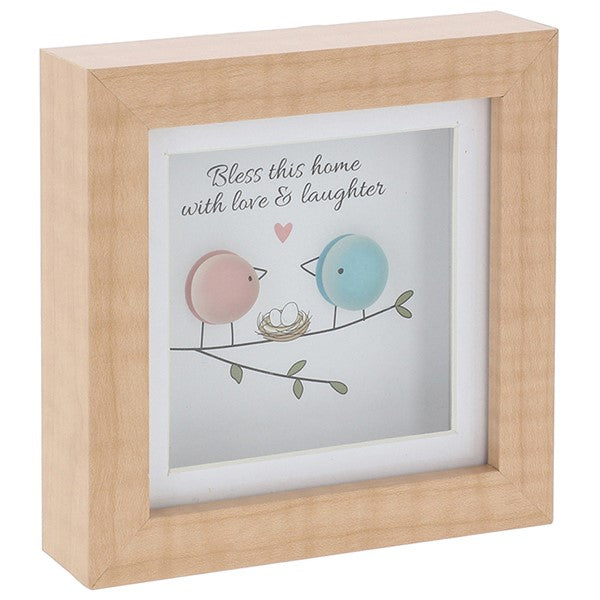 Wooden framed glass pebble picture with birds and text 'Bless this home with love & laughter' on a white background
