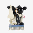 A Mickey and Minnie Mouse wedding figurine on a decorative patterned base, shown against a plain light gray background.