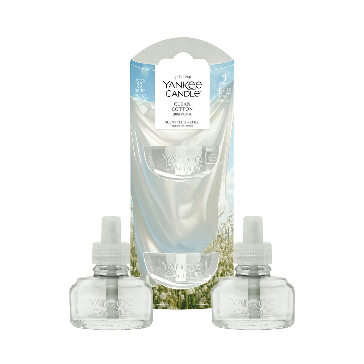 Two Yankee Candle refill bottles with white caps displayed in front of their original packaging box on a white background. The packaging features a graphic of a white cotton sheet with blue sky and green wildflower illustrations.