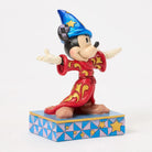 Figurine of a character in a red outfit with a blue hat on a decorative base