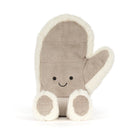 Jellycat amuseables mitten plush  toy in a warm taupe-brown fabric with cream sherpa trim, featuring a simple embroidered smiley face and small feet, shown on a clean white background.