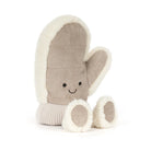 Jellycat amuseables mitten plush toy in a warm taupe-brown fabric with cream sherpa trim, featuring a simple embroidered smiley face and small feet, shown on a clean white background.