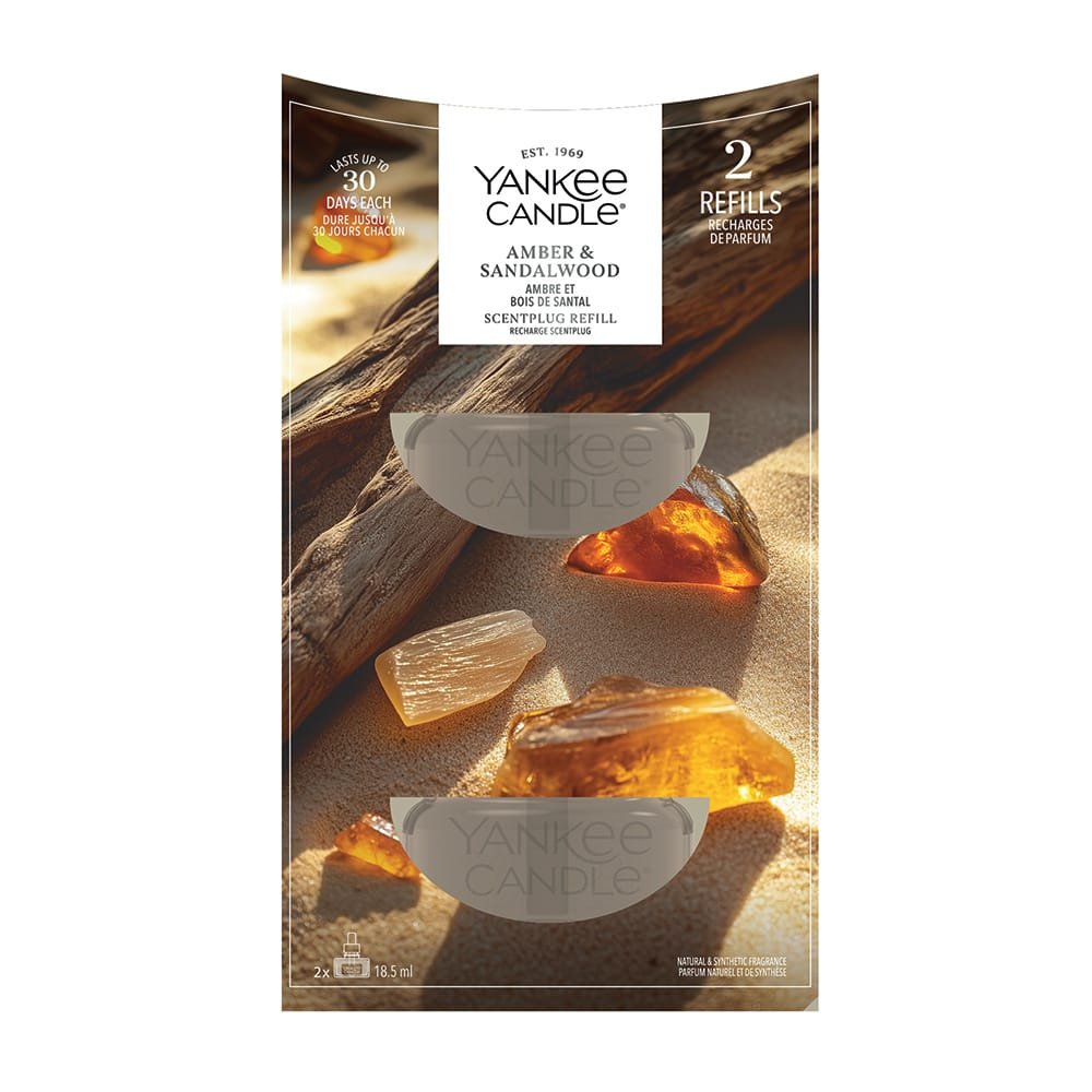 Yankee Candle Amher & Sandalwood scent refill pack, featuring a decorative wood and sand imagery on the front of the packaging.