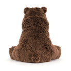 Jellcat Bizzlestomp is brown plush teddy bear. Its shown from the back, sitting down, on a clean white background.