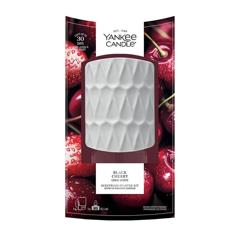 Yankee Candle Black Cherry scent starter kit in its original retail packaging, featuring a textured white wax melt container in the center against a background of glossy red cherries.
