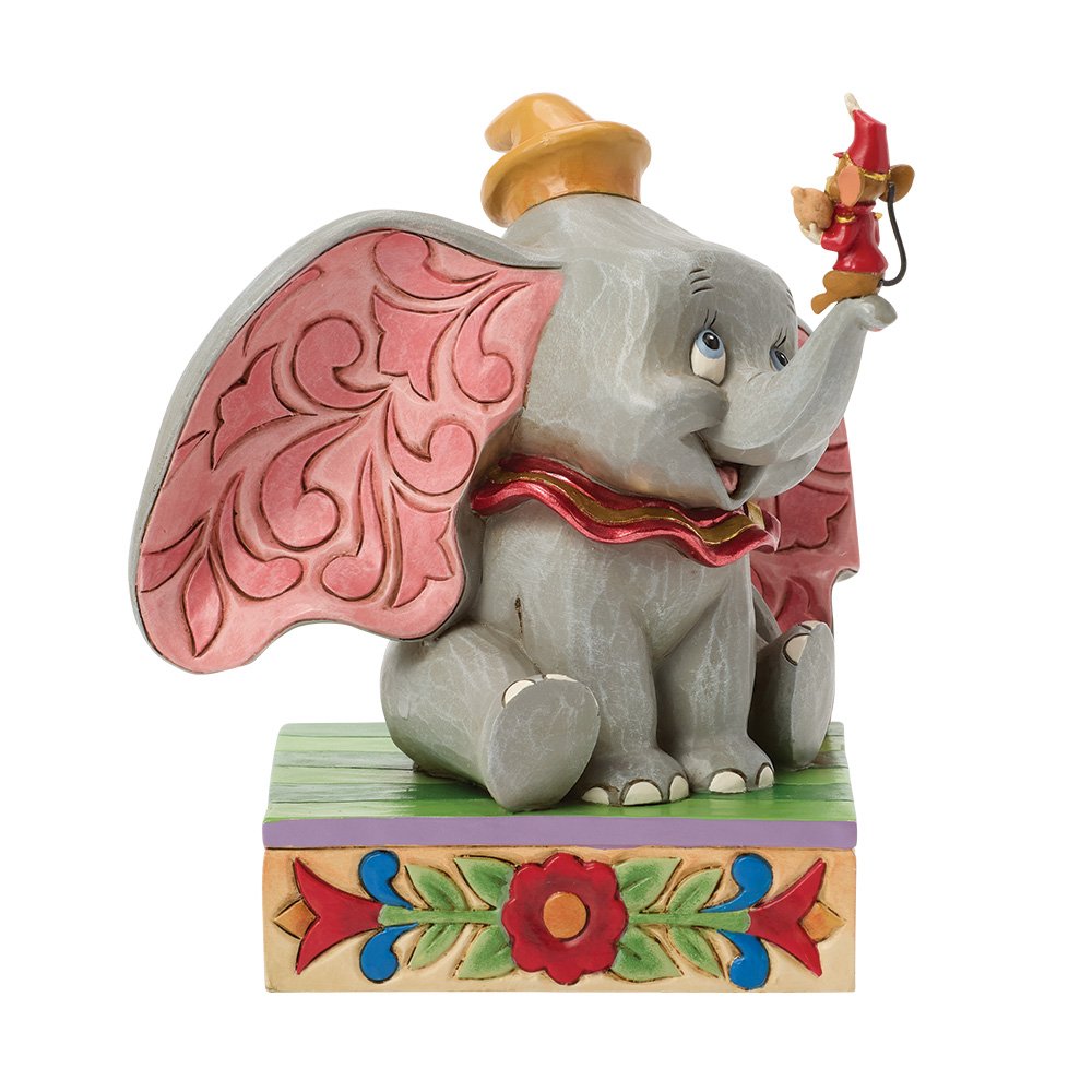 Animated Dumbo character figurine with pink wings and a small timothy figure on his nose , sat on a decorative base.