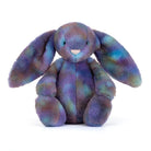 Purple,green,blue coloured Cosmic patterned plush jellycat luxe bunny on white background.