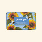 Soap bar with sunflowers and bees design on a blue background