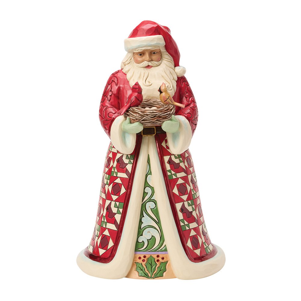 Decorative Santa figurine holding a nest on a white background