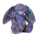 Purple,green,blue coloured Cosmic patterned plush jellycat luxe bunny on white background.
