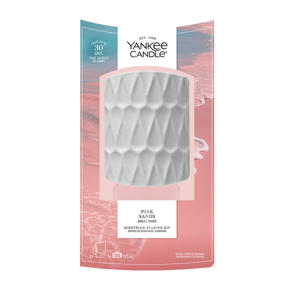 Yankee Candle Pink Sands ScentPlugStarter Kit in its original retail packaging, featuring  a clear window on a pink and blue illustrated card.