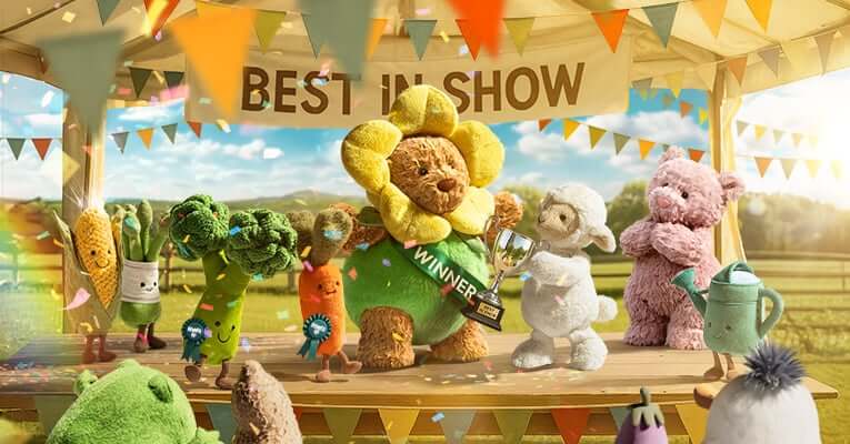 Toy animals with a sunflower character holding a trophy under a 'Best in Show' sign.