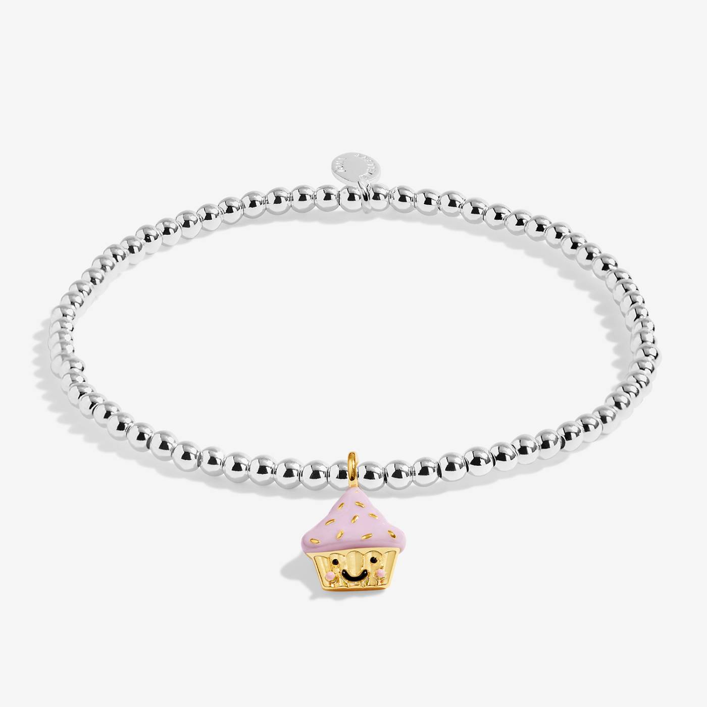 A silver-plated beaded stretch bracelet featuring a cute gold and pink cupcake charm with a smiling face, set against a clean white background.