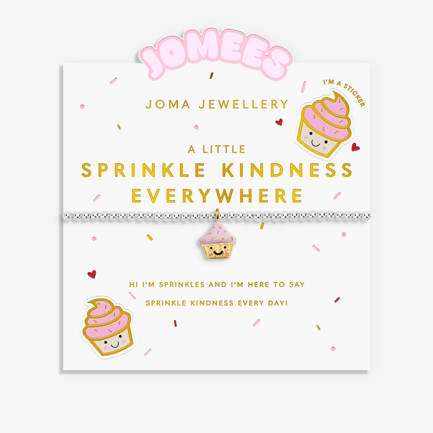 A Joma Jewellery bracelet displayed on its branded card. The bracelet is a delicate silver-plated beaded bracelet with a small pink and gold coloured cupcake charm.