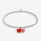 A silver-plated beaded bracelet featuring two small enamel Heart charms in red and pink, with gold-tone accents, shown on a light gray background.