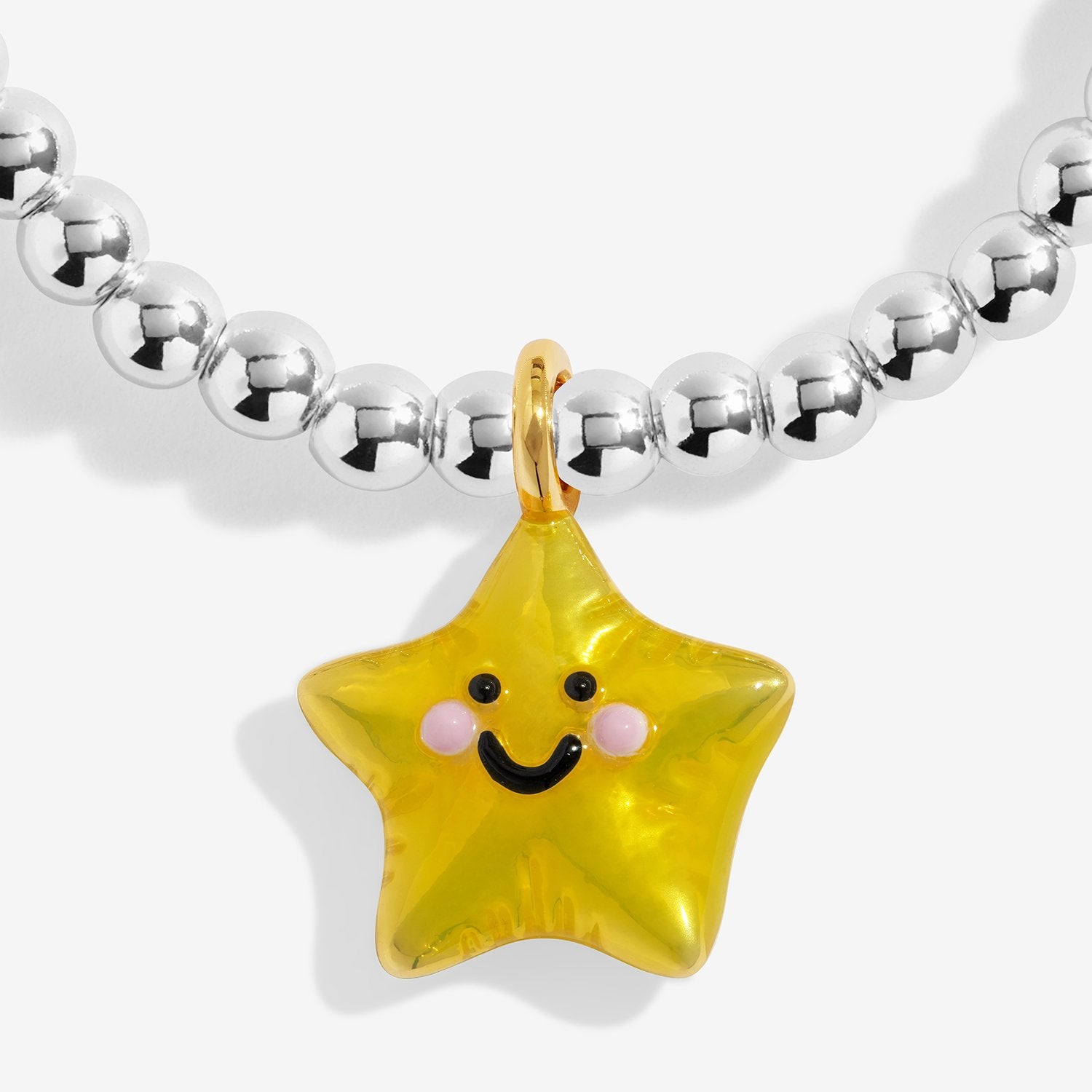 Silver-plated  beaded bracelet with a yellow star-shaped charm on a white background