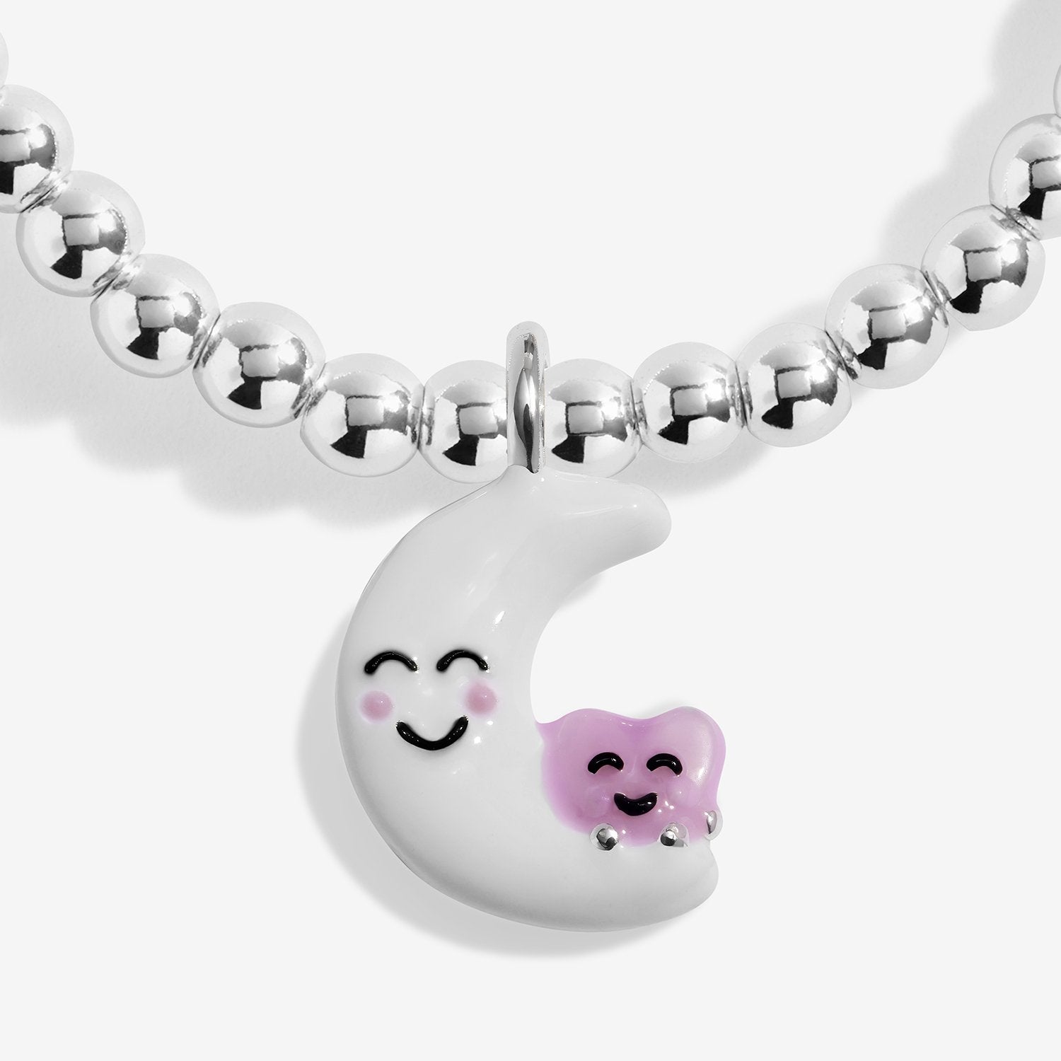 Silver-plated beaded bracelet with a smiling moon and heart charm on a white background