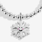A silver-plated beaded bracelet featuring a white snowflake charm with a smiling face and pink cheeks, shown against a light gray background.