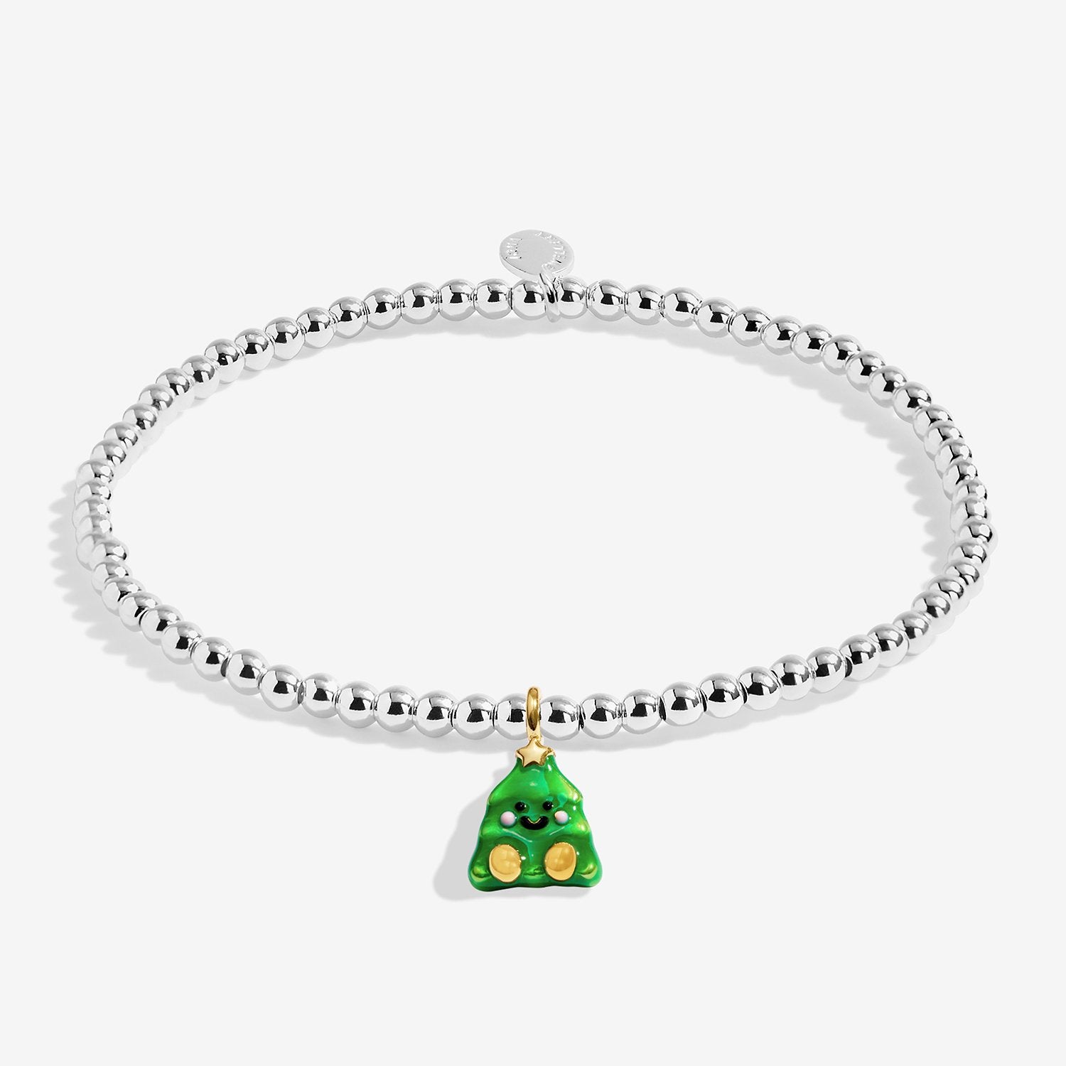 A silver-plated beaded bracelet with a green Christmas tree charm featuring gold accents, displayed on a light gray background.