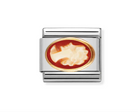 close up of composable nomination Italy cameo charm. featuring a carved female's head on orange shell backing set in 18k yellow gold on a stainless steel composable link.
