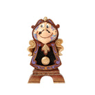 cogsworth Decorative figurine of a smiling face with decorative elements on a white background