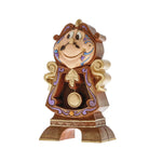 cogsworth clock figurine with a smiling face on a white background