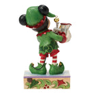 Mickey Mouse Elf figurine holding a gift on a decorative base with a white background