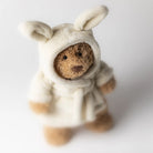 Jellycat Bartholomew Stuffed teddy bear wearing a cream bathrobe on a light background