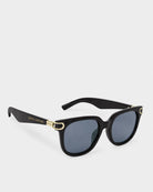 Black Katie Loxton Manhattan sunglasses with gold accents on a white background