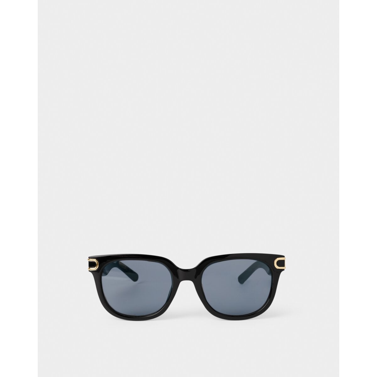 Katie Loxton Manhattan Black sunglasses with gold accents on a white background