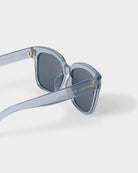 katie loxton Blue roma sunglasses with gold accents on a white background
